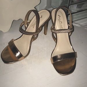 Beautiful strappy gold stiletto high heel